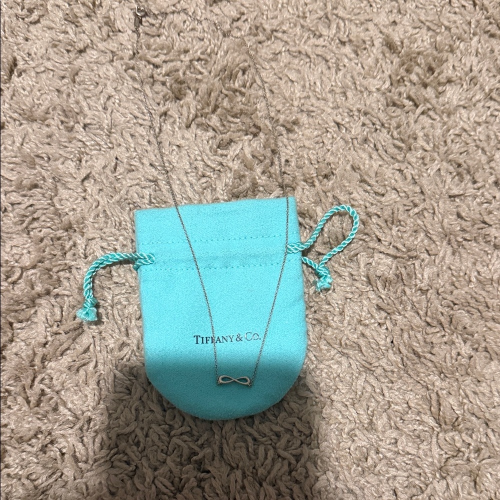 Tiffany & Co. Silver Infinity Pendant with Blue Pouch